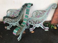 Pair of substantial wrought iron bench ends along with the matching central support