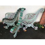 Pair of substantial wrought iron bench ends along with the matching central support