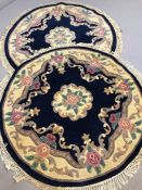 Pair of circular blue ground woollen oriental rugs, approx 115cm in diameter