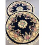 Pair of circular blue ground woollen oriental rugs, approx 115cm in diameter