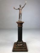 Small Bronze of a man holding a cross and a ball on a Corinthian column wooden stand (total height