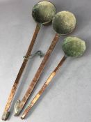 Set of three Arts and Crafts copper ladles, the longest approx 45cm in length