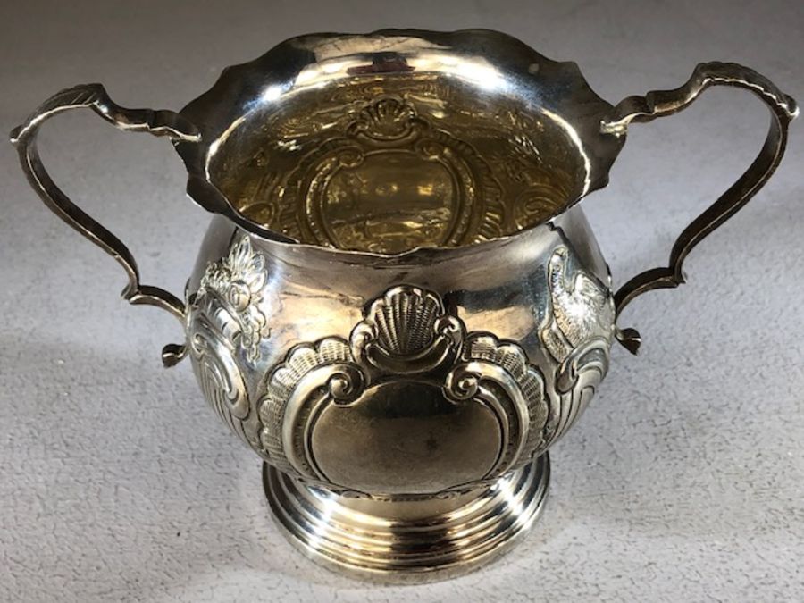 Silver hallmarked loving cup with two repousse design on a stepped base Birmingham Walker & Hall - Image 2 of 5