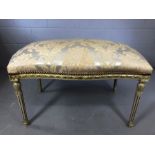 Oblong footstool with painted fluted legs and upholstered damask cushion, approx 88cm x 58cm x