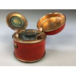 Tin plate and copper travelling inkwell with original glass liner in red