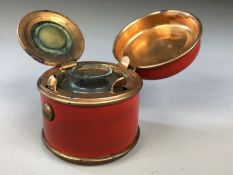 Tin plate and copper travelling inkwell with original glass liner in red