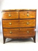 Bow fronted chest of four drawers with brass circular handles, intricate inlay and original key,