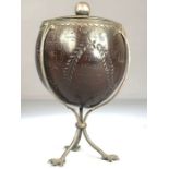 Scrimshaw Silver mounted coconut with silver Lining and lid on tripod Ostrich feet and dated 1815