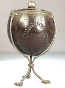 Scrimshaw Silver mounted coconut with silver Lining and lid on tripod Ostrich feet and dated 1815