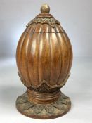 Carved decorative wooden tea caddy in shape of a fruit or a nut on circular carved base approx