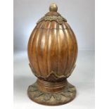 Carved decorative wooden tea caddy in shape of a fruit or a nut on circular carved base approx