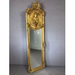 Large gilt framed, bevel edged mirror with relief figure of a lady, approx height 177cm x 52cm wide