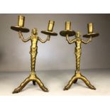 Pair of solid heavy brass double candlestickes male and female emerging from a twisted sea shell