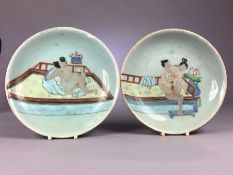 Pair Chinese Green ground plates or bowls hand painted with erotic scenes, the lady with bound