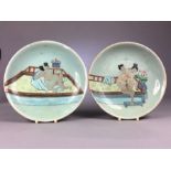 Pair Chinese Green ground plates or bowls hand painted with erotic scenes, the lady with bound