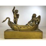 Brass sculpture of an old man with wings (possibly Father Time) being skippered by a Cherub in a