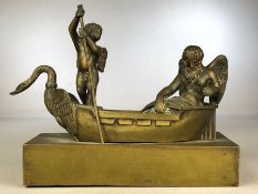Brass sculpture of an old man with wings (possibly Father Time) being skippered by a Cherub in a