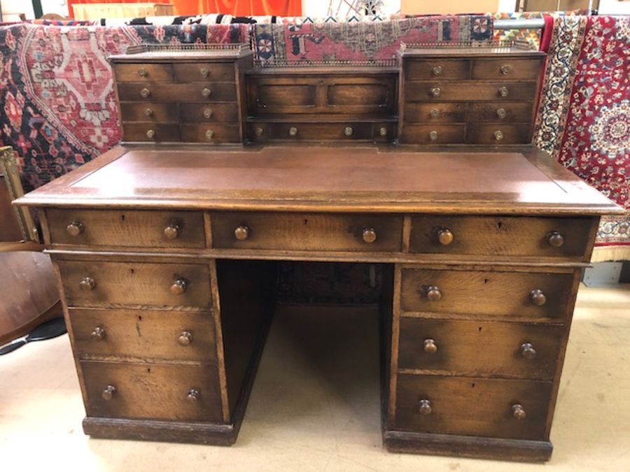 Leather-topped twin pedestal Victorian writing desk with upstand containing numerous smaller drawers