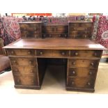 Leather-topped twin pedestal Victorian writing desk with upstand containing numerous smaller drawers