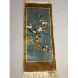 Small decorative rug depicting birds flowers and fruit approx 47 x 110