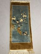 Small decorative rug depicting birds flowers and fruit approx 47 x 110