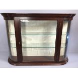 Wall mounted display cabinet with glass shelves, approx 87cm x 22cm x 61cm tall, with key