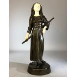 Bronze Figurine of a lady in Medieval dress carrying a staff with carved bone face and hands with