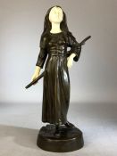 Bronze Figurine of a lady in Medieval dress carrying a staff with carved bone face and hands with