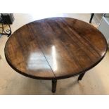 Drop leaf oak dining room table on reed and turned legs, approx 113cm wide, with eight upholstered