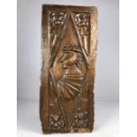 Gothic carved Oak Panel possibly 16th century a Tudor style head within a diamond panel with foliate