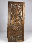 Gothic carved Oak Panel possibly 16th century a Tudor style head within a diamond panel with foliate