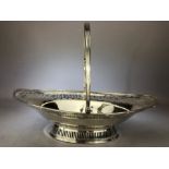 Large Georgian Oval Hallmarked Silver basket with Pierced decoration, hinged handle and oval foot,