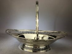 Large Georgian Oval Hallmarked Silver basket with Pierced decoration, hinged handle and oval foot,