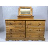 Pine chest of six long drawers and a pine dressing table mirror