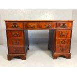 Twin pedestal desk with nine drawers, approx 122cm x 61cm x 75cm tall