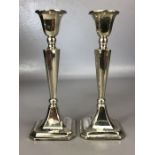 Pair of hallmarked silver candlesticks (bases filled and one with repair A/F) approx 18cm tall