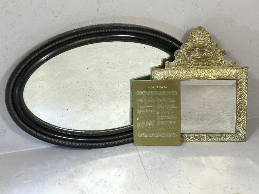 Decorative brass-framed mirror, approx 50cm x 39cm, an oval ebonised wall mirror, approx 81cm x