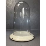 Vintage glass display dome on white ceramic base, approx 41cm in height