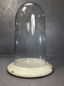 Vintage glass display dome on white ceramic base, approx 41cm in height
