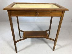 Edwardian inlaid silver table with bevelled glass, yellow silk lining, shelf below and key, approx