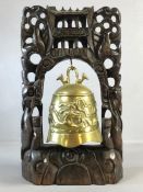 Chinese brass gong depicting dragons in a carved wooden frame, approx 39cm in height