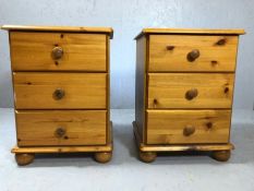 Pair of pine bedside cabinets with three drawers on bun feet, approx 43cm x 39cm x 59cm tall