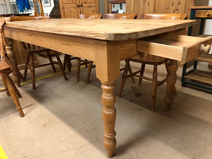 Pine farmhouse style dining table with drawer to one end and turned legs, approx 183cm x 90cm x 77cm - Image 5 of 6