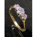 18ct Gold three stone Diamond ring central stone approx 0.25ct and ring size 'O'