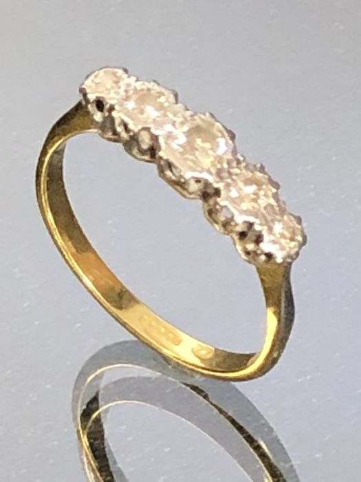 Five Stone Diamond ring on 18ct Gold Band approx size 'R'