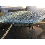 Green metal garden table, approx 140cm x 79cm