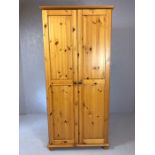 Pine two door wardrobe with hanging rail and shelf, approx 83cm x 54cm x 185cm tall