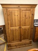 Pine two door wardrobe with drawer under, approx 128cm x 60cm x 190cm tall