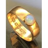18ct Gold wide band fully hallmarked ring set with a single opal approx 4mm in diameter, size '
