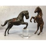 Pair of leather rearing horses, approx 40cm in height (A/F)